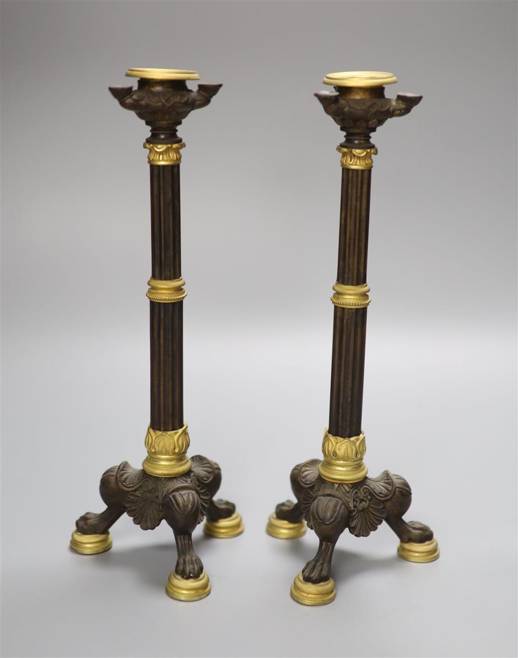 A pair of 19th century French bronze and ormolu mounted candlesticks height 27.9cm (2)